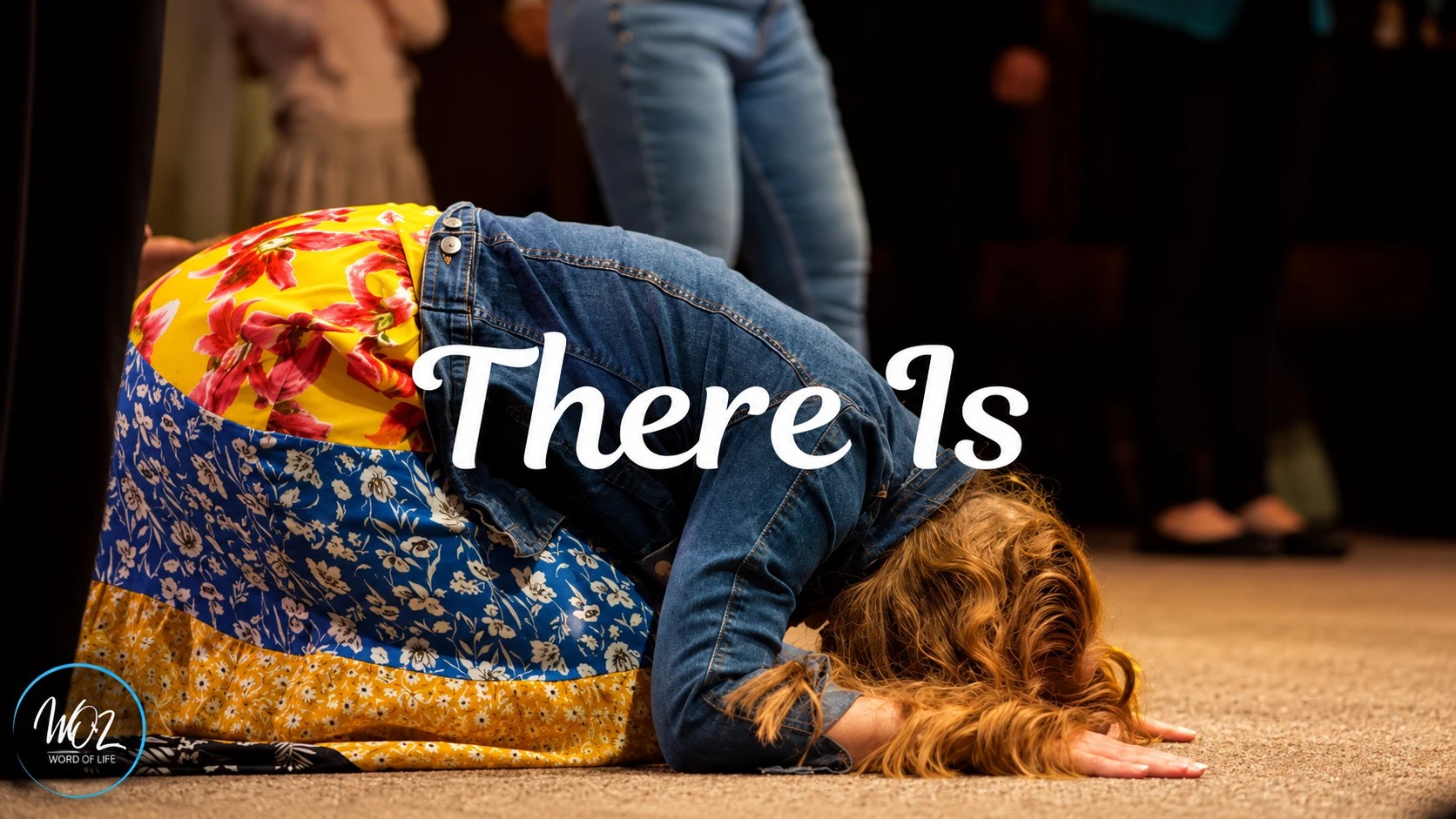 There is: a woman kneeling in prayer