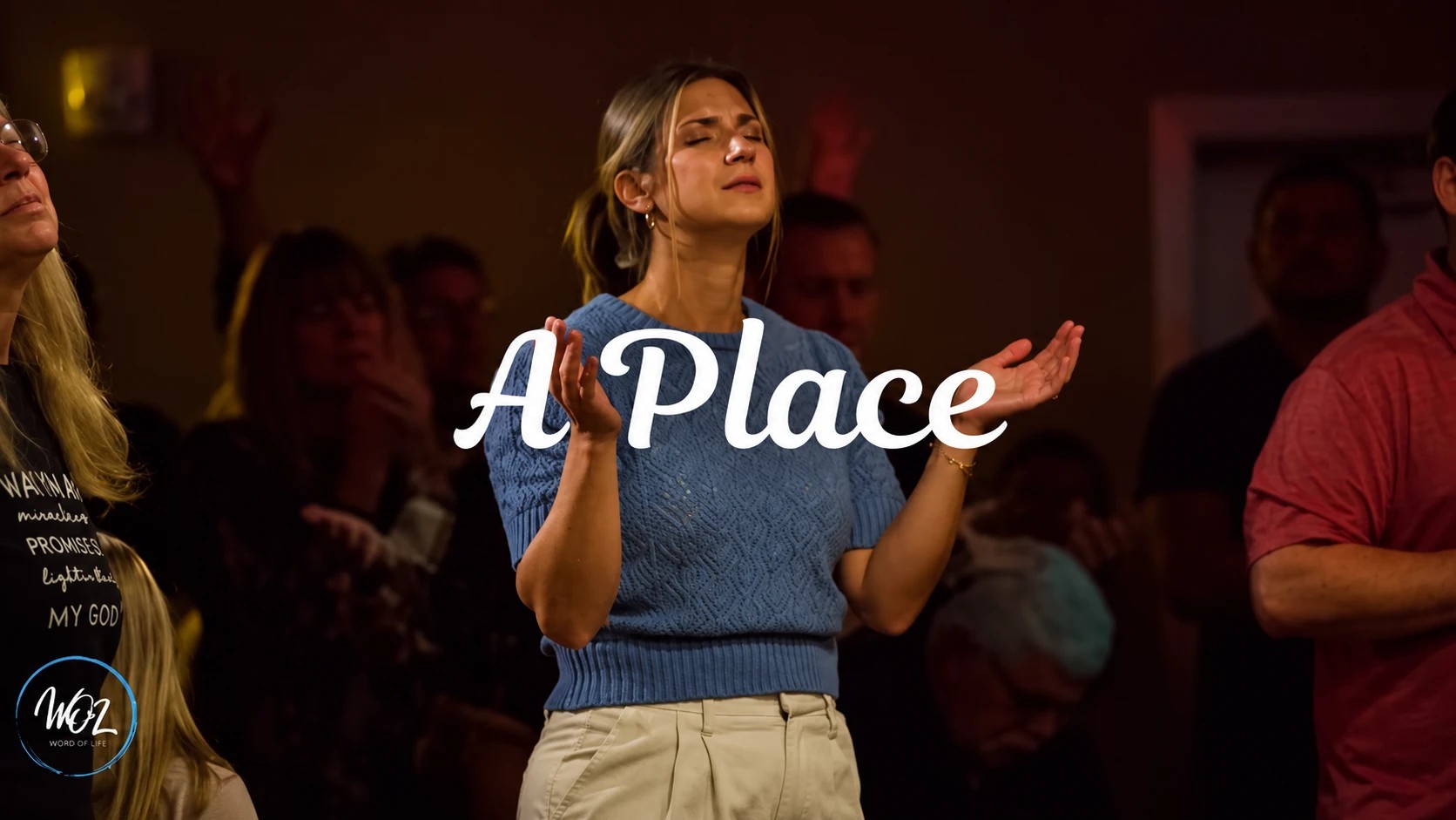 A place: a woman worshiping with open hands